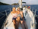 Debbie and Andrea relaxing on the bow. Scorpious Island astern