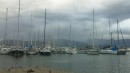 Nanjo and rain clouds in front. The smallest yacht on my pontoon.