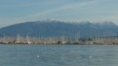 Snow on the mountains behind the boat yards at Preveza