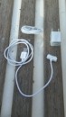 The accessories. Earphones, charger cable and European mains electric plug. They look genuine Apple? Maybe they are?
