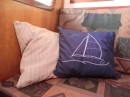 The scatter cushion covers I made by hand. The left was made from a torn blouse - boom knocked me over leaving Trinidad.  The blue is sheeting and I drew the picture from my Bible cover and my first attempt of embroidery. It helped to keep me busy whilst the seas were rough, as well on calm days 