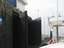 This photo is a little out of sequence as its from the Miraflores locks.  It shows the curved shape of the leaves that make up the gates of the locks.  The locks are double to provide some insurance against an accident that might damage one set of locks and allow Lake Gatun to drain into the ocean.  An accident like that would put the canal out of commission for months wihile the water levels in the lake were allowed to build up again.  The gates dont close flat.  See the album on our Miraflores tour for more detail about how the gates work.