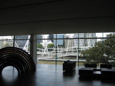 The best example of the way the gallery building shapes the visitors view of the outside world is the hall with floor to ceiling windows that looks out onto the Kurilpa pedestrian bridge and the city beyone. 