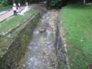 There are two fast flowing rivers that run through Palenque.  

The Mayan engineers controlled the course of the rivers with stone lined canals and were able to provide a way to route running water to various parts of the city.  The stone walls are still in place and are visible even in the un-excavated areas of the site.