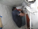 Shawn gets all the fun jobs.  Here is he during the process of installing the high pressure vessel in the long narrow locker on the starboard side of the pilot house.