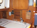 We installed the controls for the water maker behind a louvered door just above the galley sink.  The louvered door to the left provides access to the locker where the pressure vessel is installed.  The first two pics in this gallery were taken through that door.