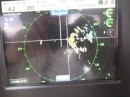 This is the display of our new Simrad broadband 3G radar set on the 6 mile range.  the two white lines that cross to the right of center indicate the tip of Barber