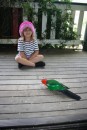 Taja on the front deck feeding a King Parrot