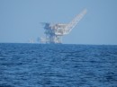 Oil rigs off Venezuela.  You can see the size of them by the boat on the right side just about to pick up oil