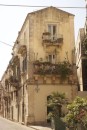 Back streets of Siracusa with the lovely steelwork balconies