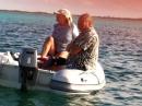 Dinghy Ride at Dusk: On our way to the bonfire on the beach in our new dinghy and engine.  