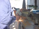 water muffler being repaired at welding shop