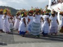 Carnival parade with local women dressed in tropical garb.