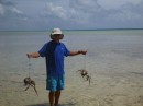 Tom holds the coconut crab at a distance...