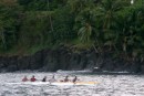 Paddlers out for an early morning training session in their outrigger canoe 
