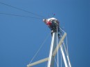 Tom fixes a halyard at the top of the mast