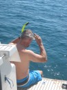 Tom gets ready for a snorkle - beautiful tropical reef fish surround the boat