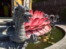 a dragon guards a Budhist temple 