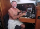 The Captain Pulls Down Weather Reports At The Nav Station