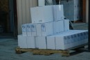 75 boxes waiting to be loaded on starboard side of Blue to correct list