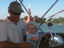 Rob gives William aN early age helming lesson
