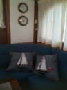 Swagmans old cushions which were handmade by Sue.  Plus new wall cladding behind clock / barometer