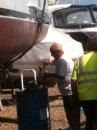 Nipper giving his final touches to his antifouling as the boat is lifted ready to launch.