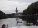 Coming up to Port de Plaisance, Epernay with tower of Champagne de Catellane by riverside.