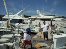 The guys cleaning the boat