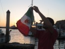 Putting up the Mexican courtesy flag after checking in to Ensenada, Mexico!