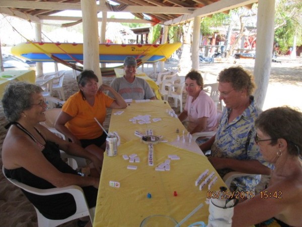 Mexican train dominos on the beach or as locals call the game Dominos Cubano (Cuban Dominos....:)