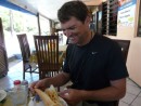 Allen inspects his Chicken Sandwich with fries, fries included inside!
