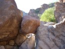 in the lowest part of the canyon, large rocks are strewn down the canyon like bowling balls