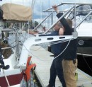 Here is Derek and his assistant fitting the solar support to the dingy davits.