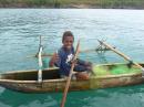 Local boy Luke in his dugout canoe with outrigger