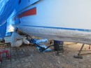 The starboard bow, fiberglassed and being faired. 