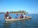 Locals going fishing - notice how they are seated & they were rowing foward....& the boat is actually backward