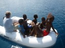A dingy full of local kids - boy,  did they love the ride