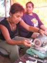 Monique carving a whales tail pendant in Tonga w/her teacher supervising (class was a birthday gift from Jaye-Jaye on s/v Blue Dawn...Thanks so much!  I loved it!!)