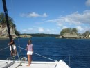 Kids on bow looking for reefs as we enter Hunga Island in Tonga