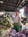 Woman selling me veggies, fruits and cooking tips in Apia, Samoa