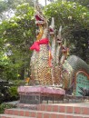 Wat Phro That Doi Suthep: Did the 2nd  dragon bite off more than he could swallow? Crocodile standing by for any leftovers.