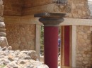 Knossos -vibrant colors on the wooden pillars and wider at the top as opposed to classical Greek marble or stone columns that are narrower at the top. Framing around doors was also wood. 