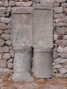 Ancient Thera.  An example how materials  of previous inhabitants were often reused by later ones.  In this case, unfinished grave markers and statue pedestals used in a wall. 