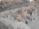 Akrotiri. Mud covered and filled the pots, nicely preserving them.