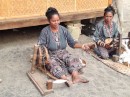 Iket weaving demonstration in Maumere - spinning cotton into thread - notice use of feet