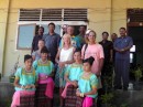 with John and Cecily from Delphian, the Headmaster on far right, teachers across the back and dancing students in front