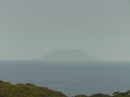 another volcanic island seen in the distance