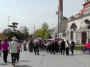 Blue Mosque in the distance, vendors with pretzels and roasted chestnuts surrounded by crowds.