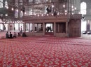 Blue Mosque: The carpeted,central area -the people give you reference to how big the interior is.